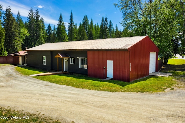 view of front facade with an outbuilding and a garage