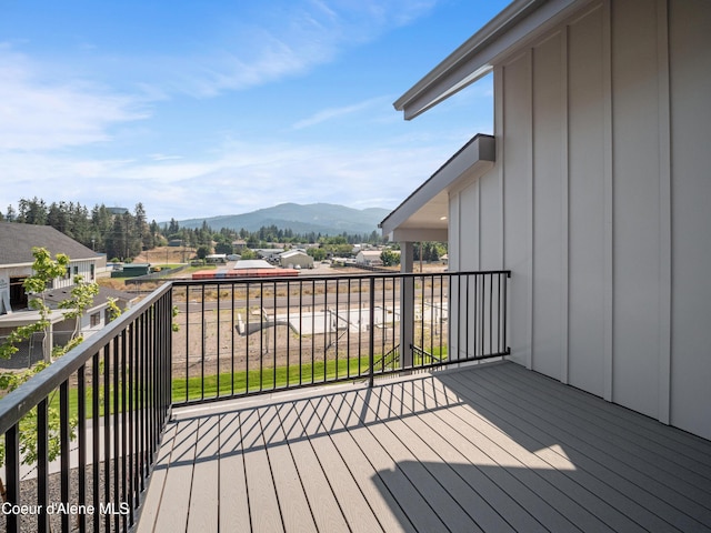 wooden terrace featuring a mountain view