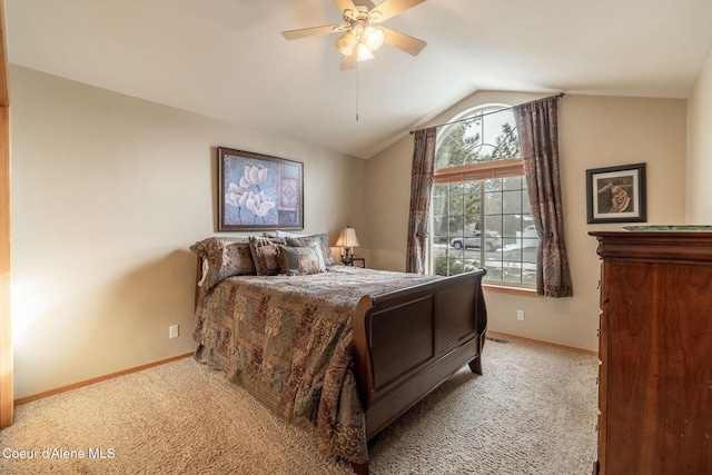 bedroom featuring lofted ceiling, light colored carpet, and ceiling fan