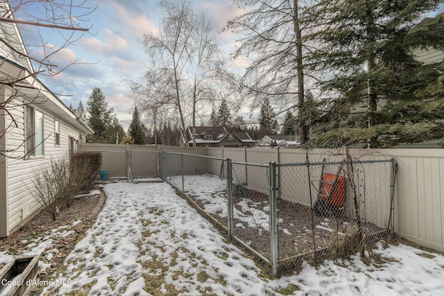 view of yard layered in snow