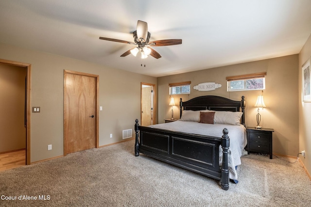 carpeted bedroom featuring ceiling fan