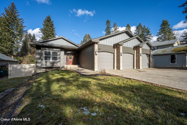 view of front of house with a garage and a front yard