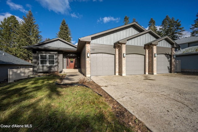 view of front of home featuring a garage and a front lawn