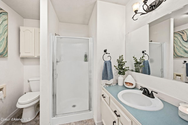 bathroom with vanity, toilet, and an enclosed shower