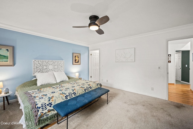 bedroom with crown molding, ceiling fan, and carpet