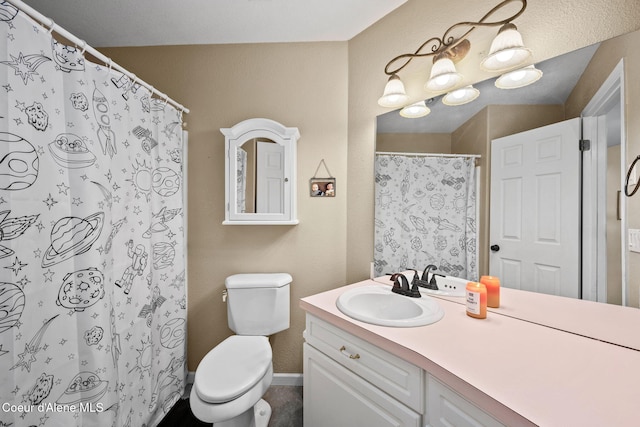 bathroom featuring vanity, toilet, and walk in shower