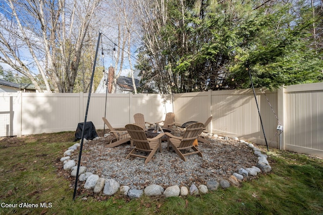 view of yard with an outdoor fire pit