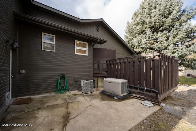 exterior space featuring a patio and central AC