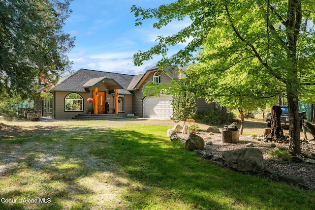 view of front facade with a garage and a front lawn