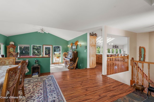 interior space with lofted ceiling, hardwood / wood-style floors, and ceiling fan