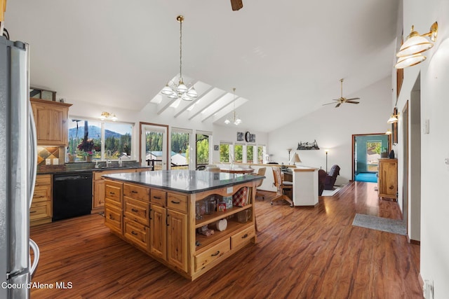 kitchen with ceiling fan, a center island, black dishwasher, and stainless steel refrigerator