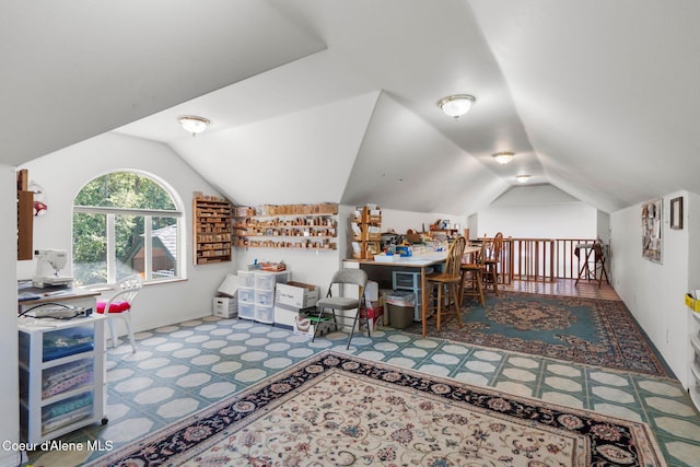 recreation room featuring vaulted ceiling