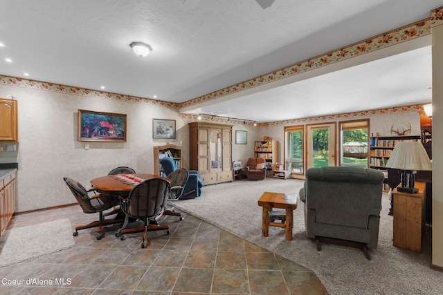 carpeted living room with a textured ceiling