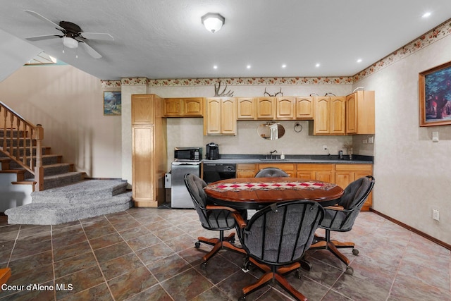 kitchen with dishwasher, sink, ceiling fan, and light brown cabinetry