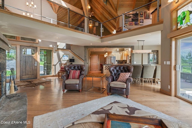 living room with wood-type flooring and a high ceiling