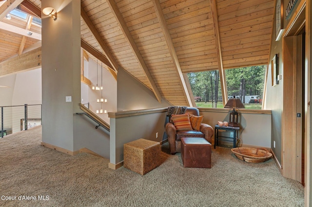 sitting room featuring lofted ceiling with beams, carpet floors, and wooden ceiling