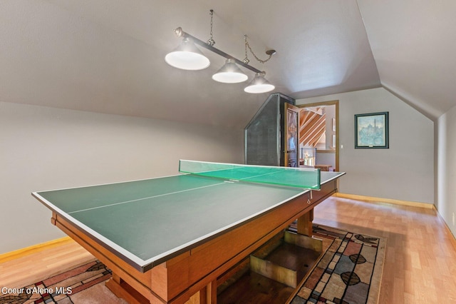 rec room featuring lofted ceiling and light hardwood / wood-style flooring