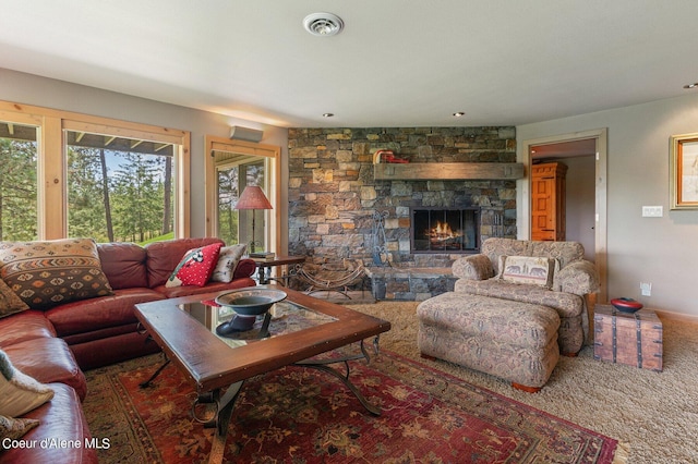 living room featuring carpet floors and a fireplace