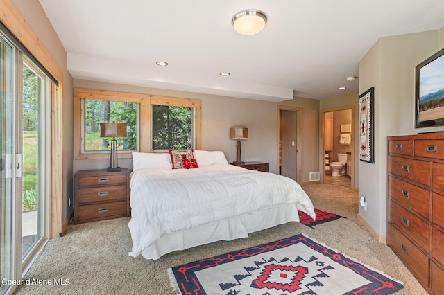 carpeted bedroom featuring access to outside