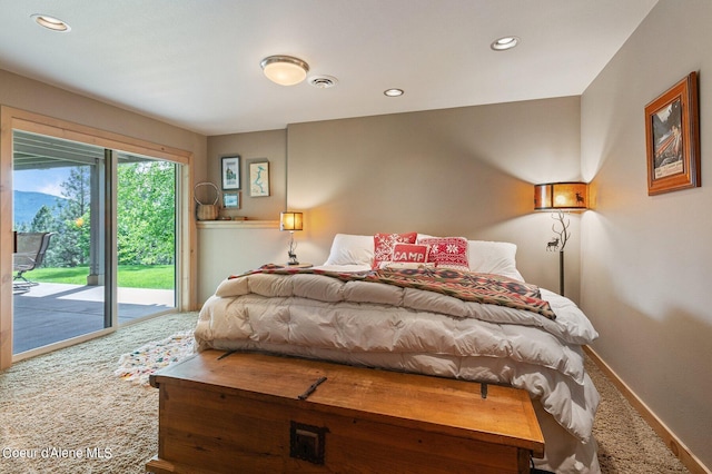 bedroom featuring carpet and access to outside