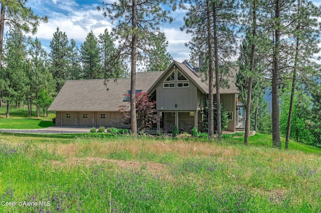 back of property featuring a garage