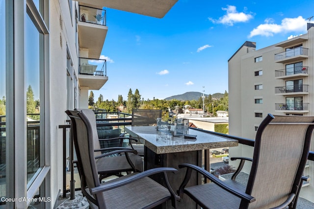 balcony featuring a mountain view