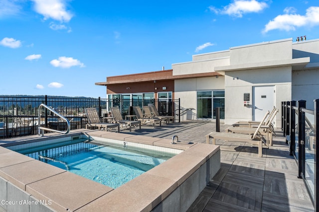 view of swimming pool with a patio