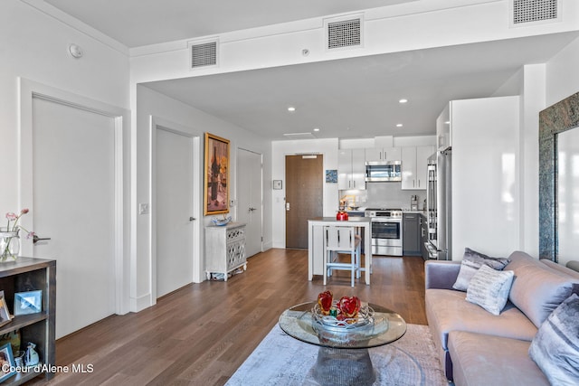 living room featuring dark hardwood / wood-style flooring