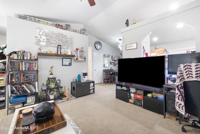 carpeted living room with vaulted ceiling and ceiling fan