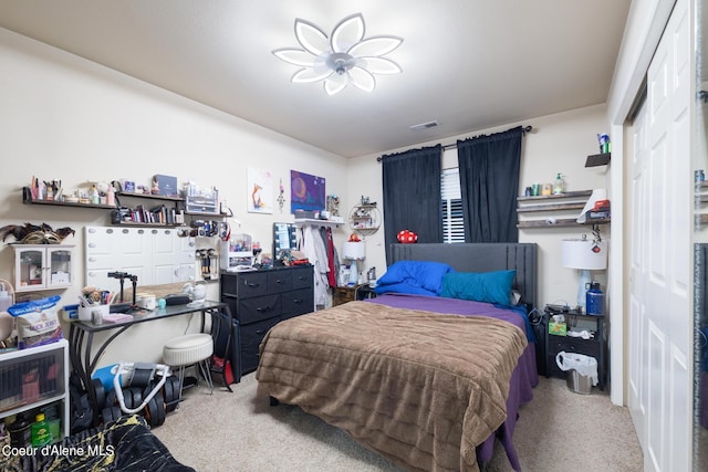 carpeted bedroom with a closet