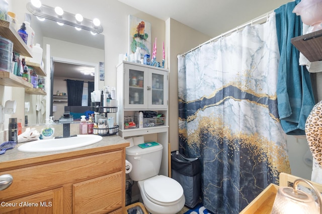 bathroom featuring vanity and toilet