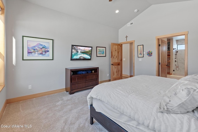 carpeted bedroom with high vaulted ceiling