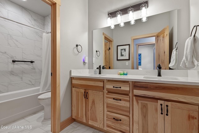 full bathroom with vanity, shower / tub combo, and toilet