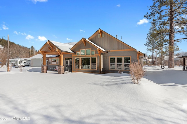 view of snow covered house