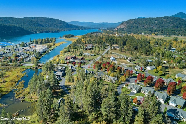 bird's eye view featuring a water and mountain view