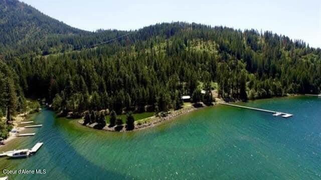 aerial view featuring a water and mountain view