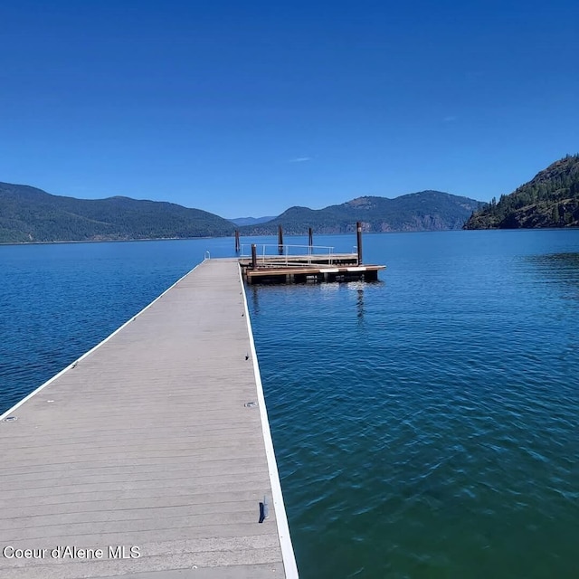 dock area with a water and mountain view