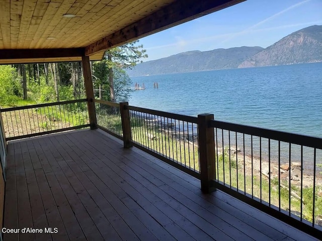 deck featuring a water and mountain view