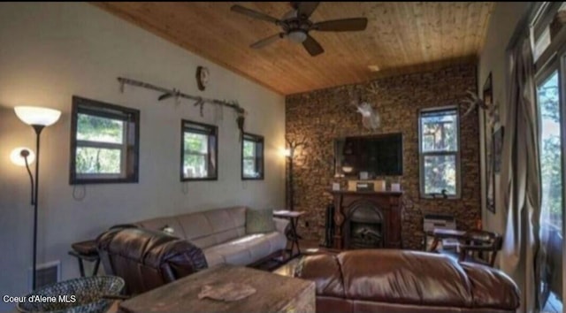 living room with ceiling fan, lofted ceiling, and wood ceiling