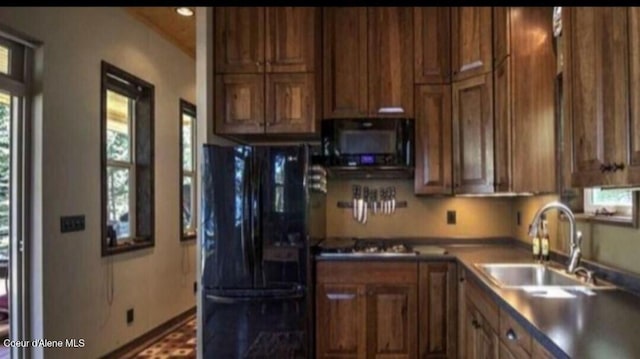 kitchen with sink and black appliances