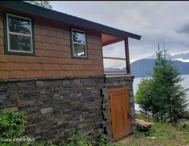 view of side of property with a mountain view