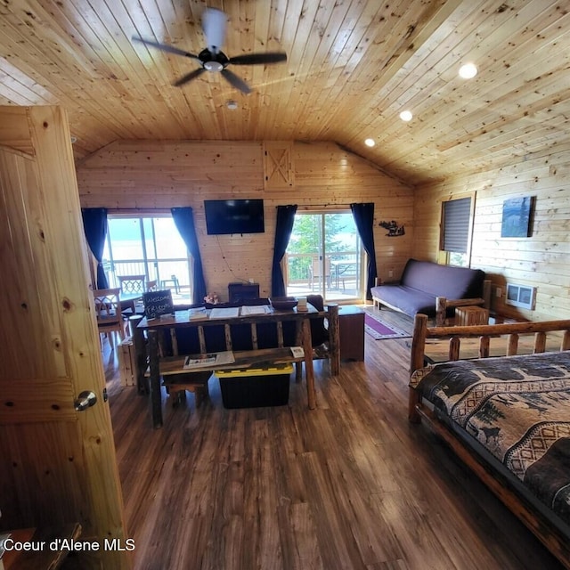 bedroom with hardwood / wood-style flooring, lofted ceiling, wooden ceiling, and wooden walls