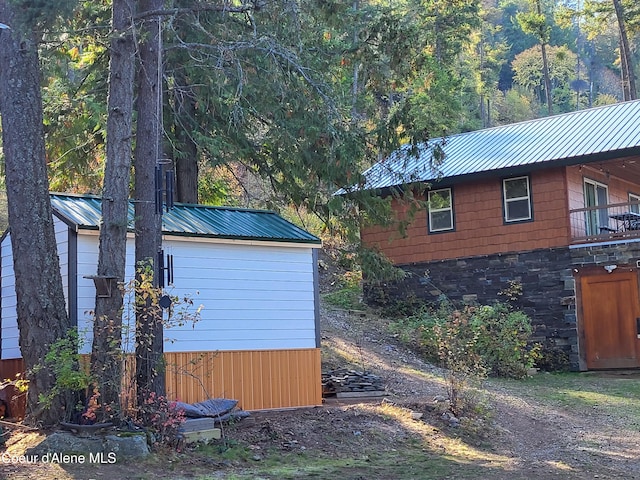 view of side of property featuring a balcony