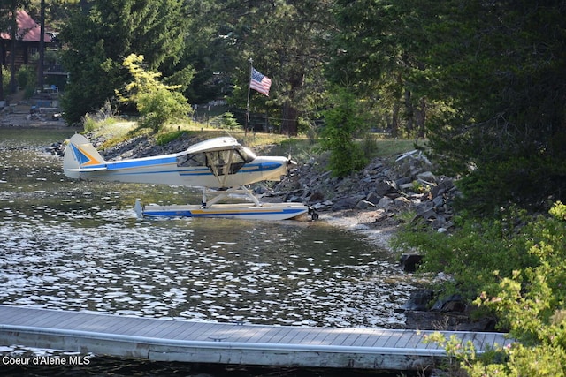 145 Cedar Dr, Bayview, ID 83803 - view of yard with a floating dock and a water view