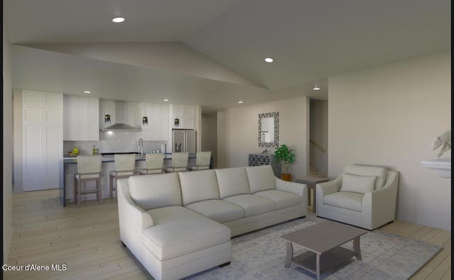 living room featuring vaulted ceiling, stairway, recessed lighting, and light wood-style flooring