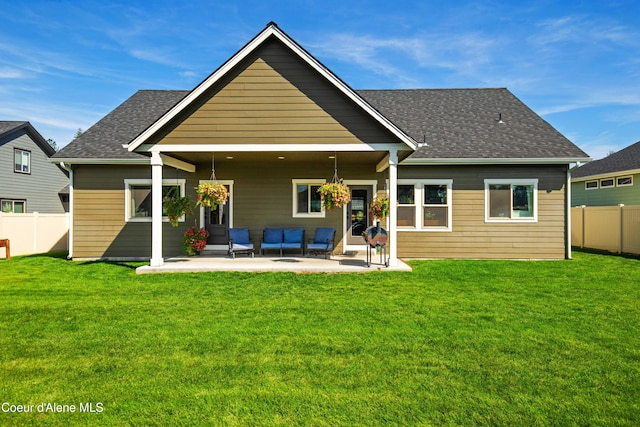 rear view of property with a patio area and a lawn