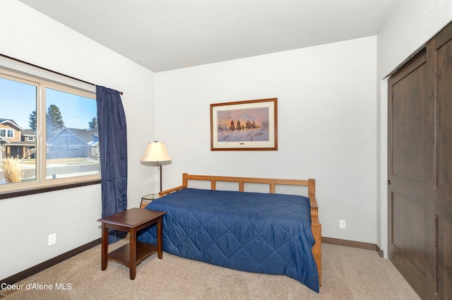 carpeted bedroom featuring a closet