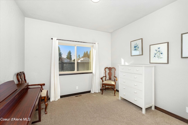 living area with light colored carpet