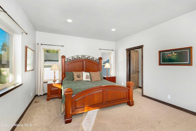 bedroom featuring light colored carpet