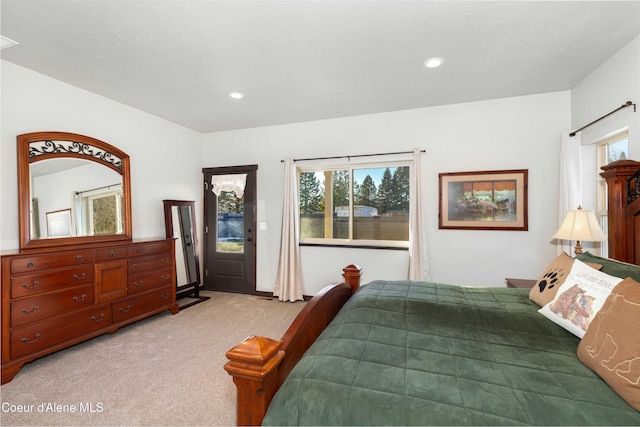 bedroom featuring light colored carpet